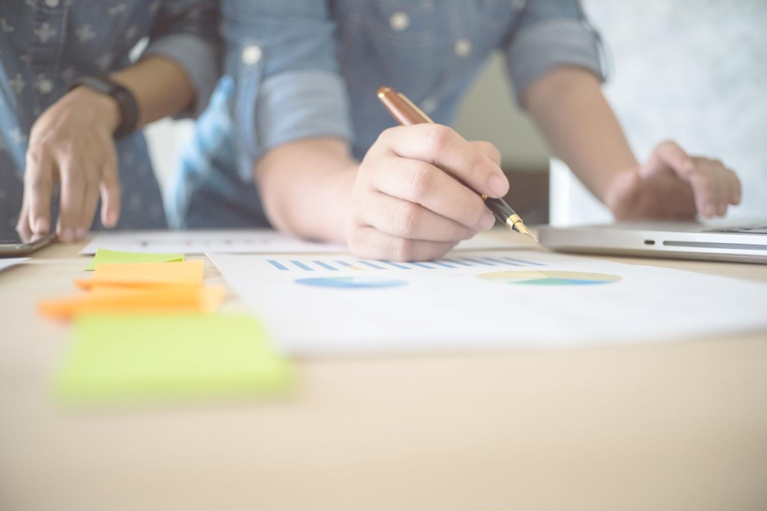 Business professional reviewing comprehensive financial reports